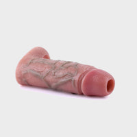 Angled shot displaying the smooth, skin-like silicone material for a natural feel of this cock sleeve.