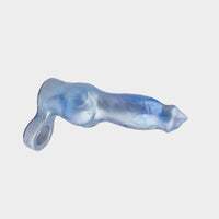 A silver silicone cock sleeve in the style of a dog.