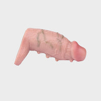Pink silicone cock sleeve on a grey background