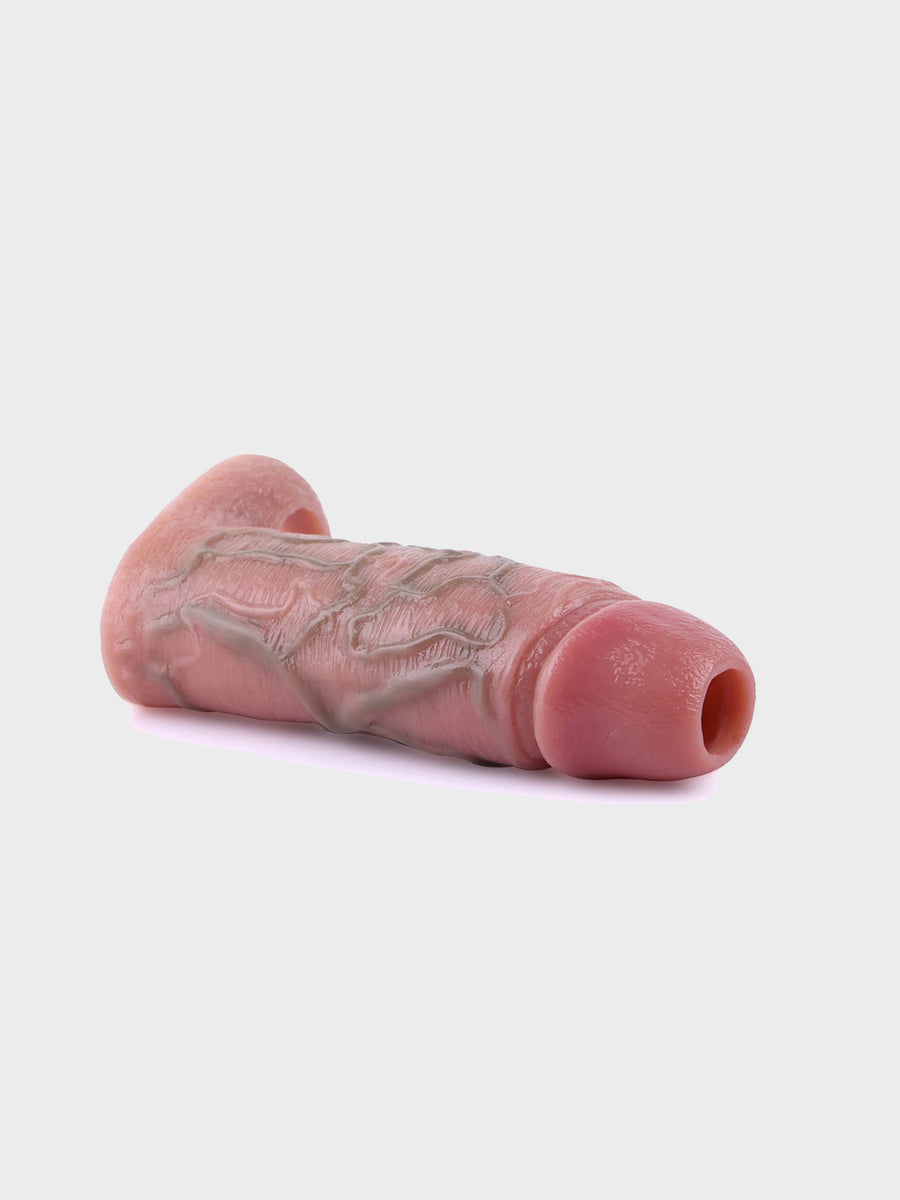 Angled shot displaying the smooth, skin-like silicone material for a natural feel of this cock sleeve.
